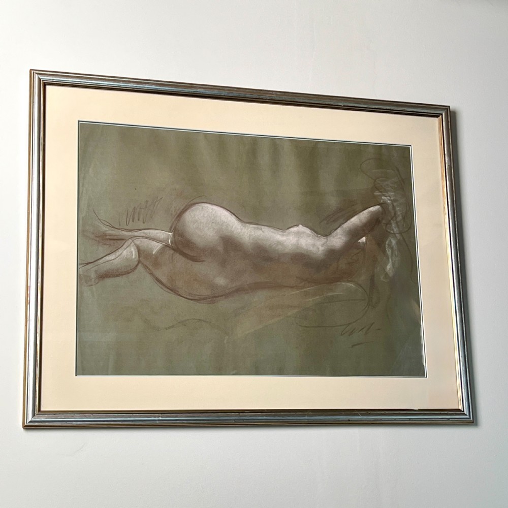 A framed charcoal and chalk life study drawing depicting a reclining female nude figure on toned paper. View III