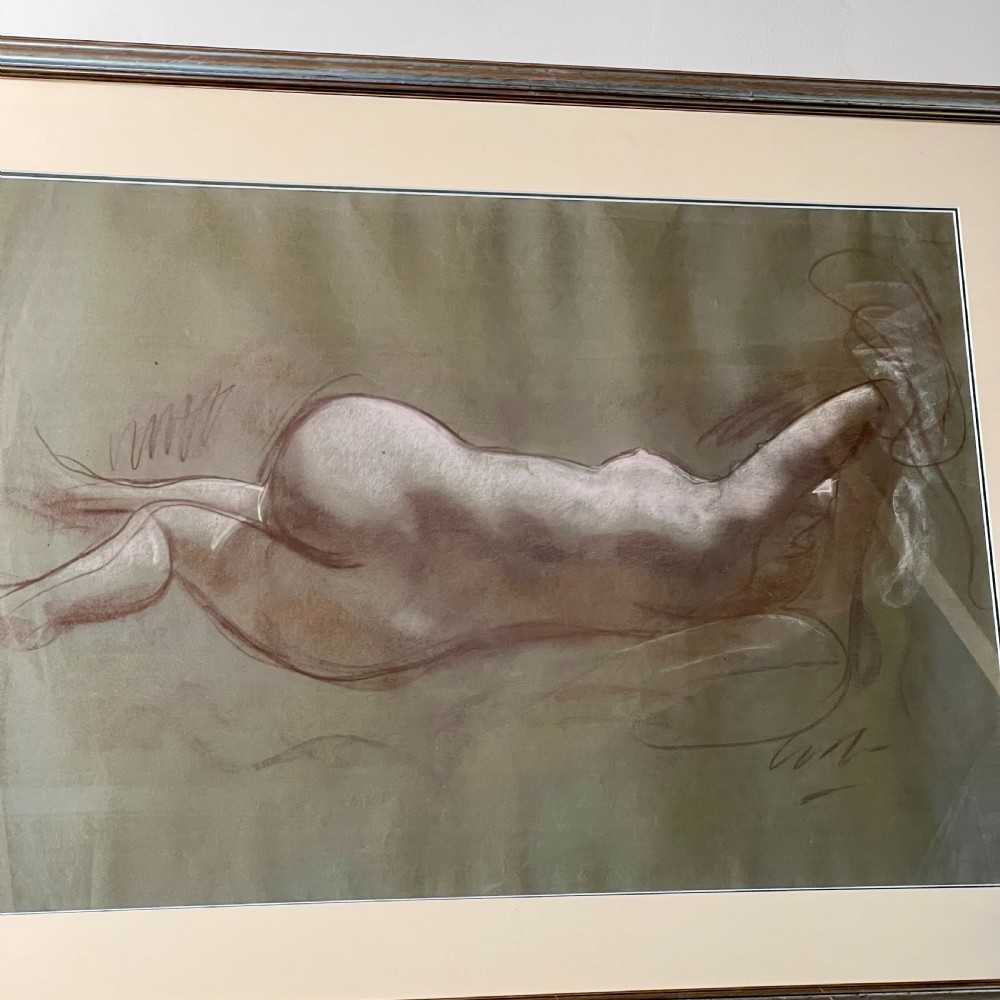 A framed charcoal and chalk life study drawing depicting a reclining female nude figure on toned paper. View IV