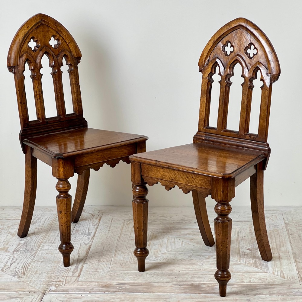 A Pair Of Gothic Oak Side Or Hall Chairs