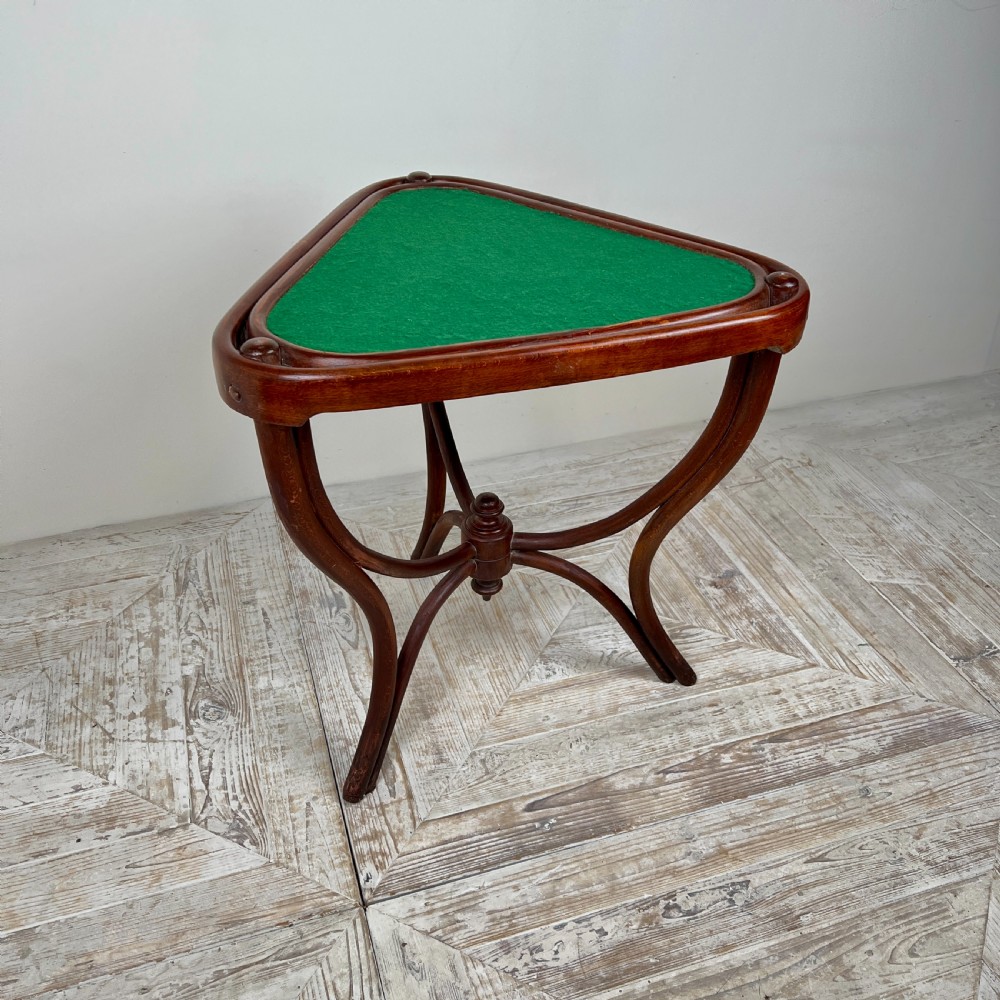 A triangular bentwood card table featuring a green felt playing surface, three curved legs, and a central turned wooden finial. View VIII