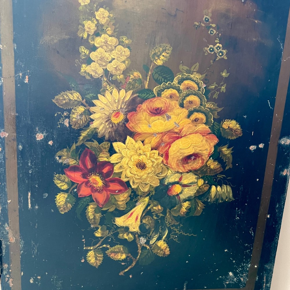 A Victorian ebonised black pine cabinet featuring two panelled doors decorated with hand-painted floral bouquets. View VI