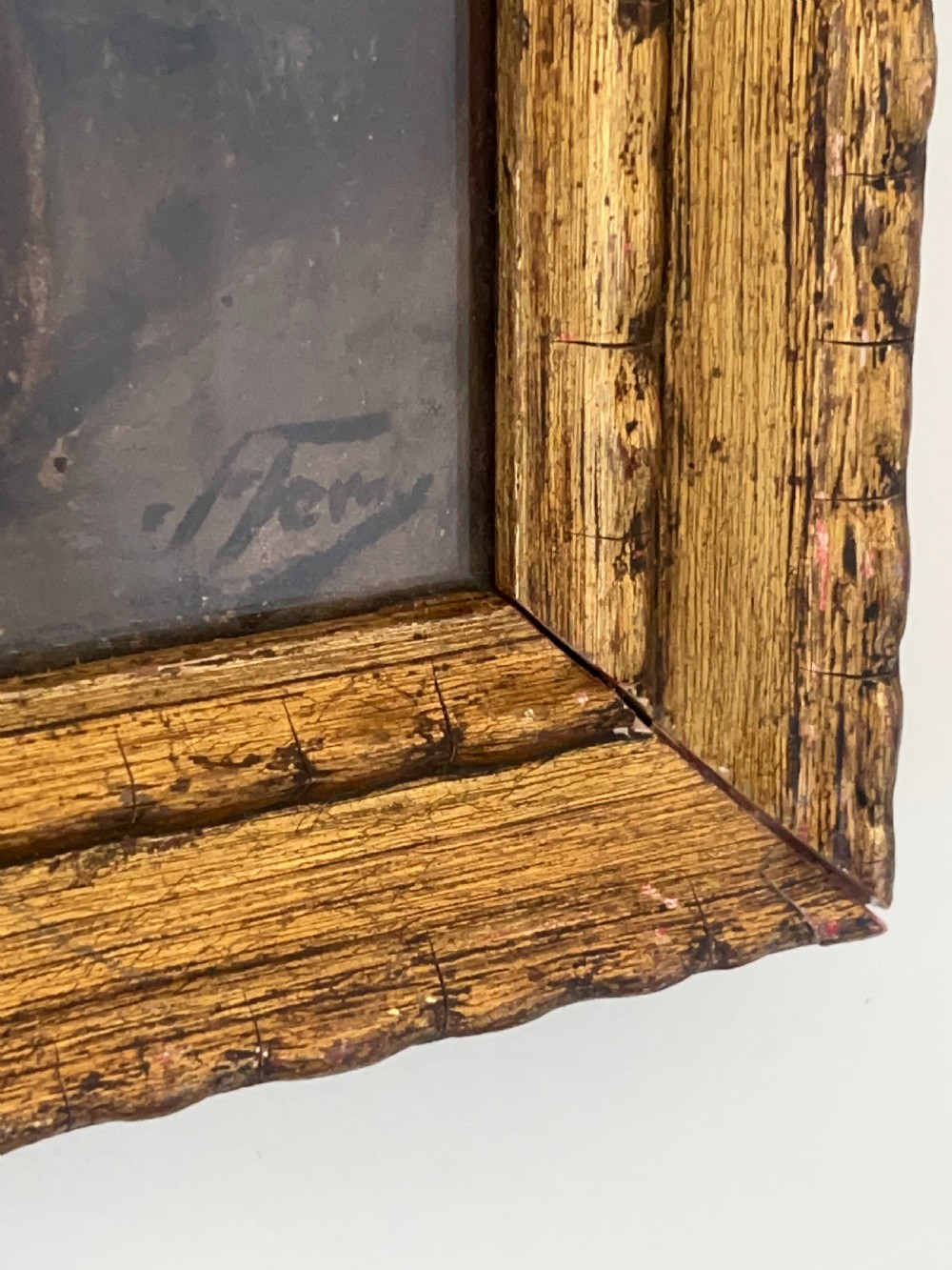 An oil painting depicting a seated woman in a light dress contained within an ornate gilt wooden frame. View VII
