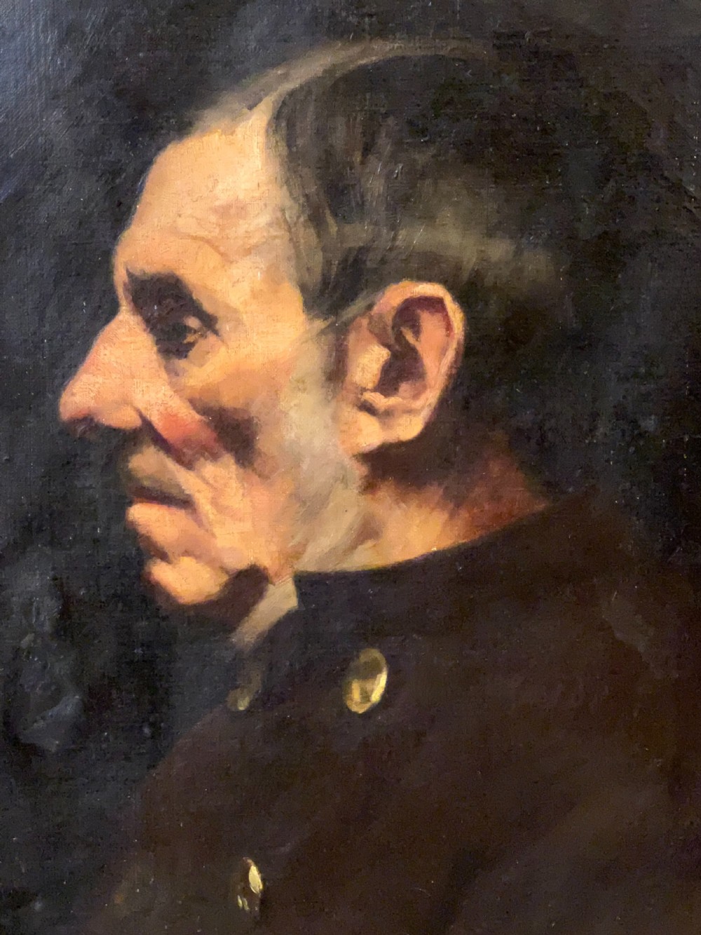 A side-profile oil portrait painting of a gentleman set within an ornate carved gilded wooden frame. View VI