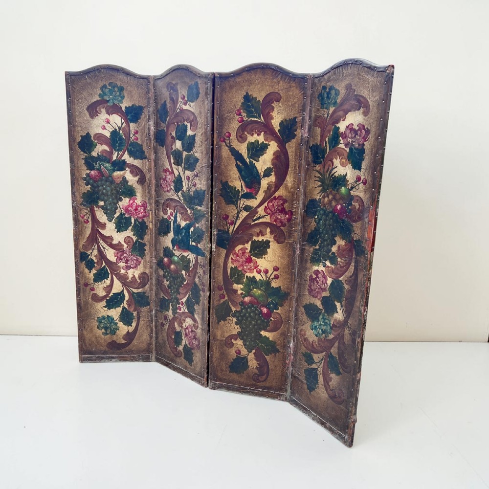 A four-panel French room divider screen made of gilt leather hand-painted with green foliage, floral scrolls, and birds, bordered with brass studding. View III