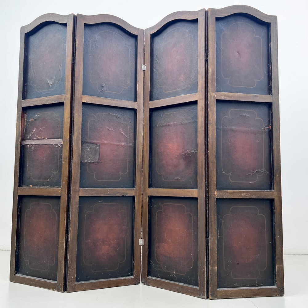 A four-panel French room divider screen made of gilt leather hand-painted with green foliage, floral scrolls, and birds, bordered with brass studding. View V