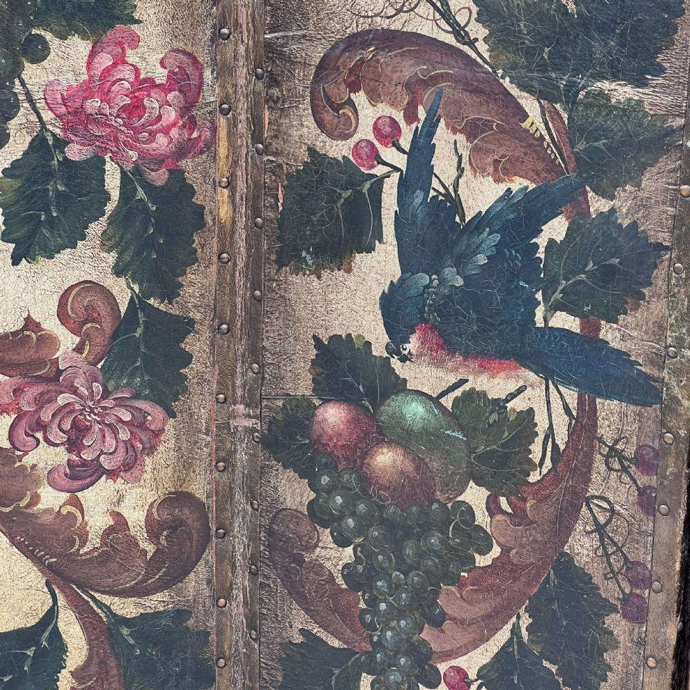 A four-panel French room divider screen made of gilt leather hand-painted with green foliage, floral scrolls, and birds, bordered with brass studding. View IX