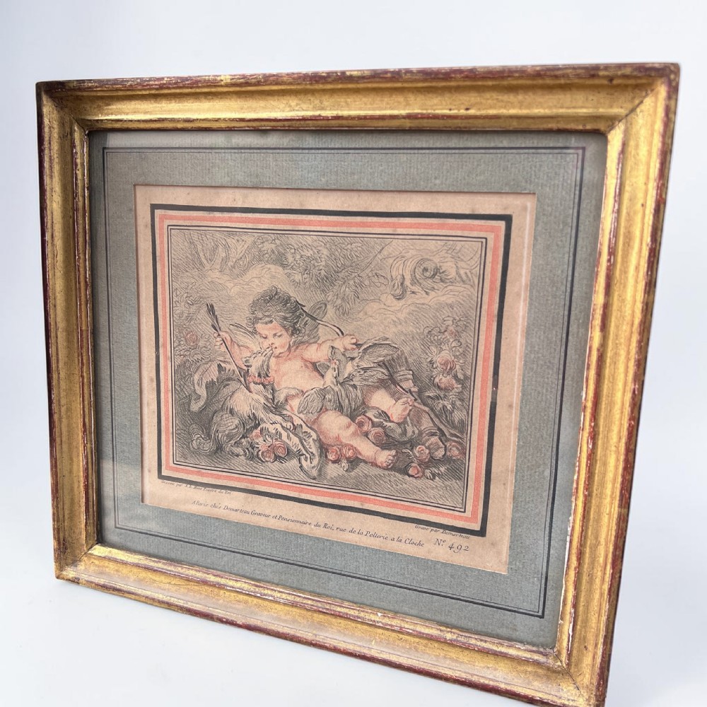 A pair of 18th-century French engravings depicting classical cherubs, mounted and framed in rectangular giltwood frames. View VI