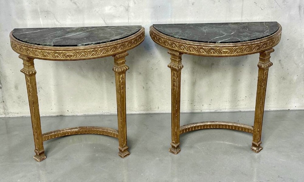 A pair of 19th-century Louis XVI Revival demilune console tables with carved gold giltwood frames and dark green marble tops. View V