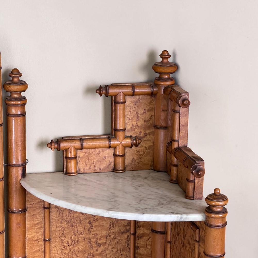 Late 19th-century French faux-bamboo birds-eye maple washstand featuring a central mirror, side shelf tiers, marble splashback and surface, over two drawers and a double cupboard. View VI