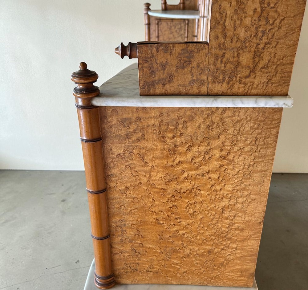 Late 19th-century French faux-bamboo birds-eye maple washstand featuring a central mirror, side shelf tiers, marble splashback and surface, over two drawers and a double cupboard. View IX
