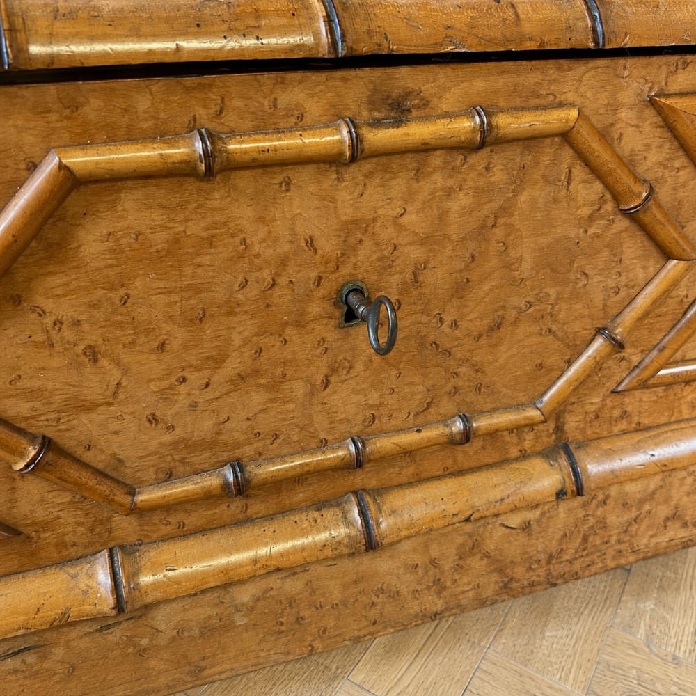 French birds eye maple single door armoire featuring faux bamboo turned mouldings, a full-length mirrored panel, base drawer, and carved cresting. View VII