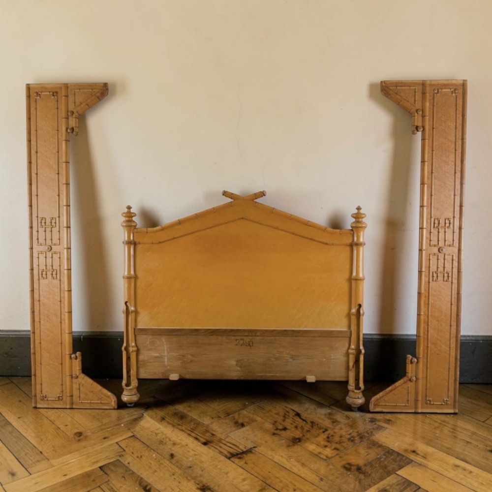 French birds eye maple single door armoire featuring faux bamboo turned mouldings, a full-length mirrored panel, base drawer, and carved cresting. View XI