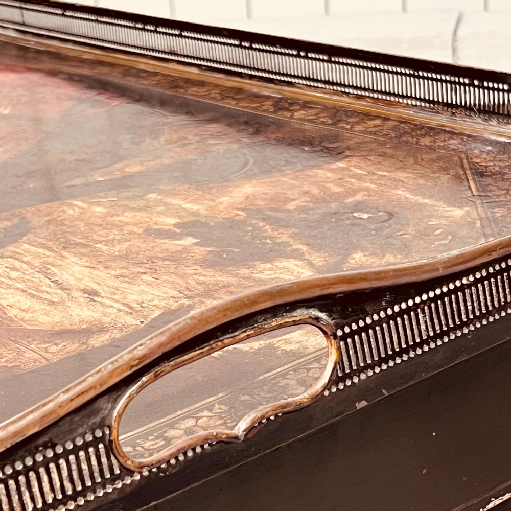 A nineteenth-century octagonal painted metal toleware tray table featuring a classical scene depicting the family of Darius before Alexander, set upon a dark wooden base. View V