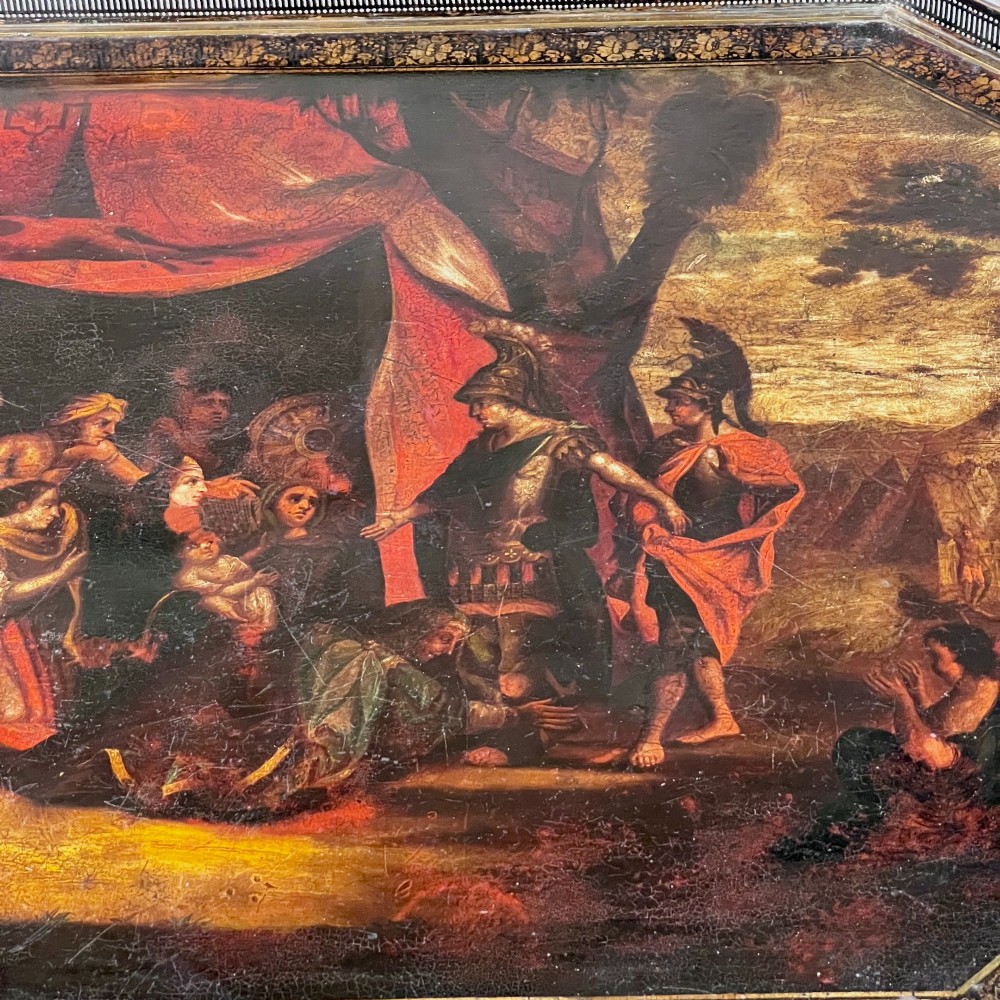 A nineteenth-century octagonal painted metal toleware tray table featuring a classical scene depicting the family of Darius before Alexander, set upon a dark wooden base. View VI