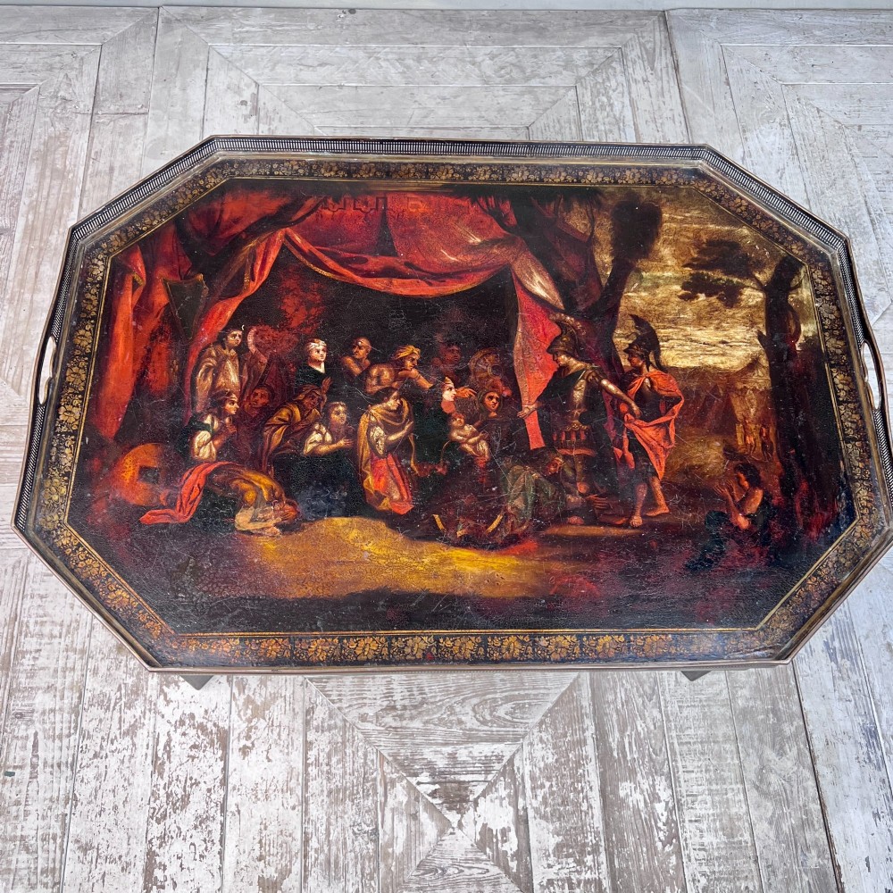 A nineteenth-century octagonal painted metal toleware tray table featuring a classical scene depicting the family of Darius before Alexander, set upon a dark wooden base. View VIII