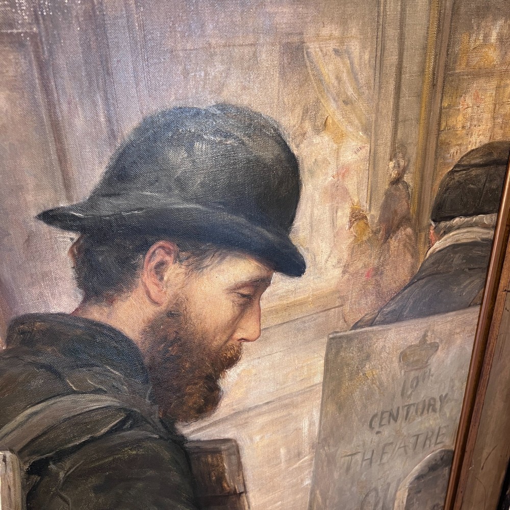 A large Victorian oil painting portraying street workers wearing sandwich boards, set within a wide gilded wood frame. View IV