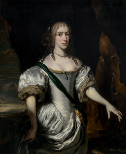 fig 1. A three-quarter length oil portrait depicting a woman in a white satin gown with a green sash, set within an ornate carved gilded frame.