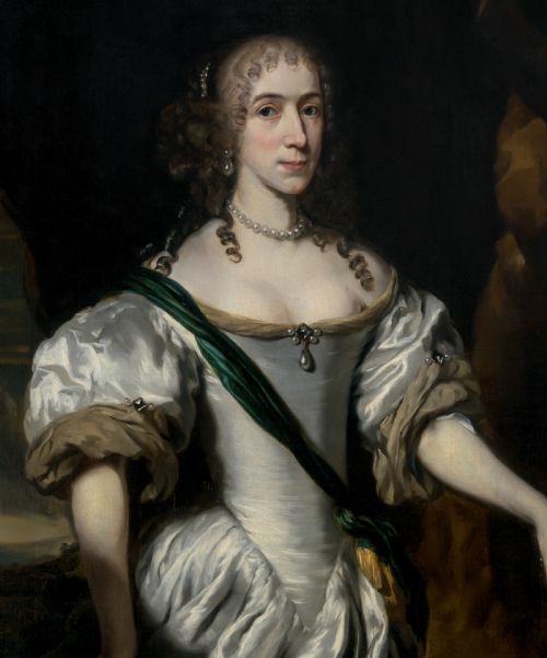 fig 2. A three-quarter length oil portrait depicting a woman in a white satin gown with a green sash, set within an ornate carved gilded frame.
