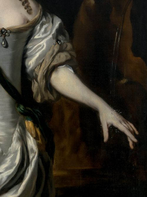 fig 4. A three-quarter length oil portrait depicting a woman in a white satin gown with a green sash, set within an ornate carved gilded frame.