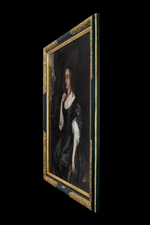 fig 2. A seventeenth-century oil portrait of a lady in a black gown with pearl jewellery, presented in an ebonised and gilt cornered timber frame.