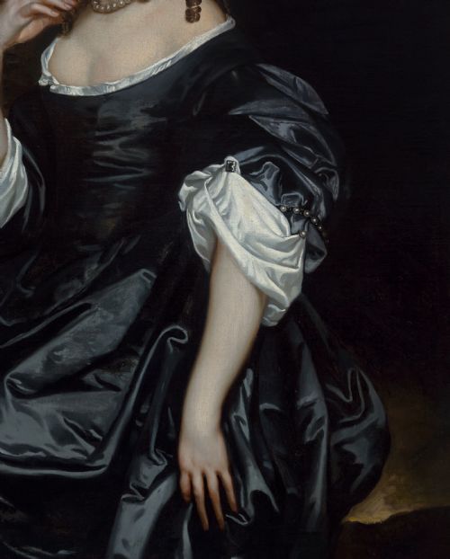 fig 6. A seventeenth-century oil portrait of a lady in a black gown with pearl jewellery, presented in an ebonised and gilt cornered timber frame.