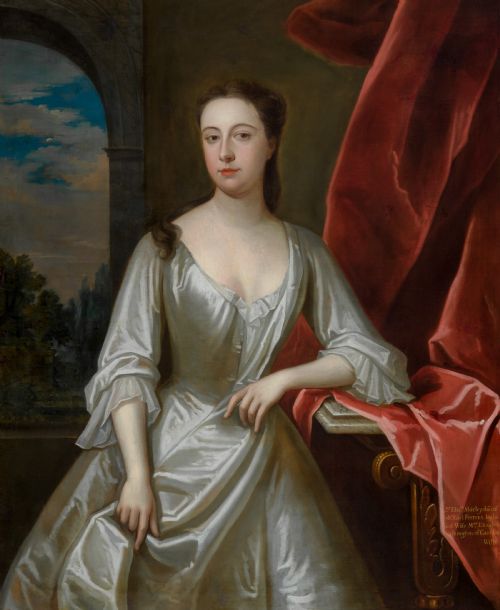 fig 4. A portrait depicting a woman in a silver satin dress seated next to draped red fabric, enclosed within an ornate carved gold frame.