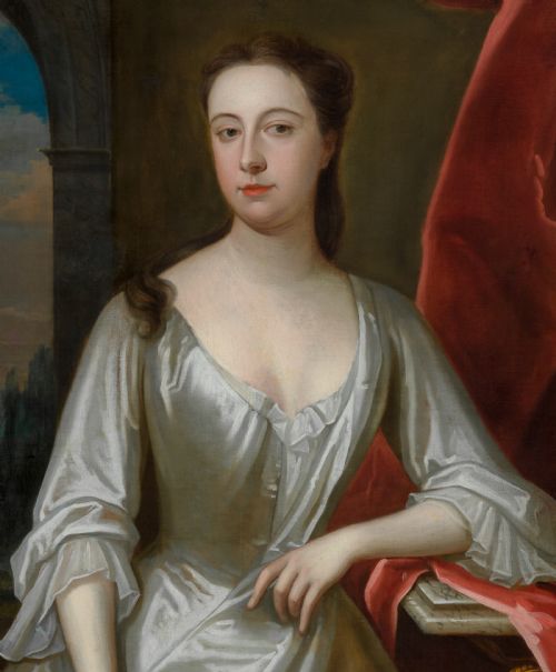 fig 5. A portrait depicting a woman in a silver satin dress seated next to draped red fabric, enclosed within an ornate carved gold frame.