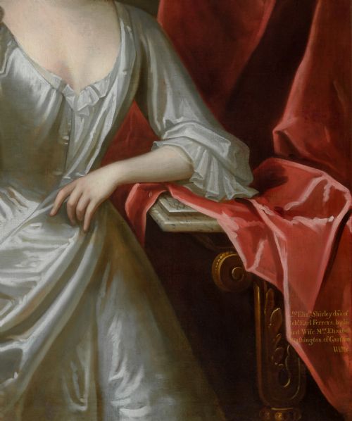 fig 6. A portrait depicting a woman in a silver satin dress seated next to draped red fabric, enclosed within an ornate carved gold frame.