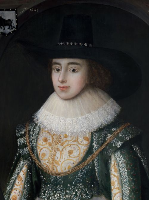fig 2. A seventeenth-century Jacobean oil portrait on wood panel depicting a woman in a wide-brimmed hat, lace ruff, and embroidered green bodice within a dark frame.