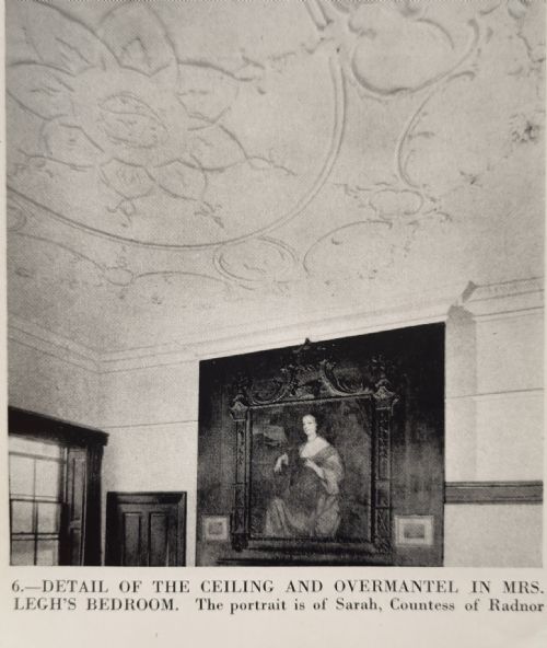 fig 2. A 17th-century oil painting depicting a seated woman in a gold satin dress within a carved giltwood frame surmounted by a coronet.