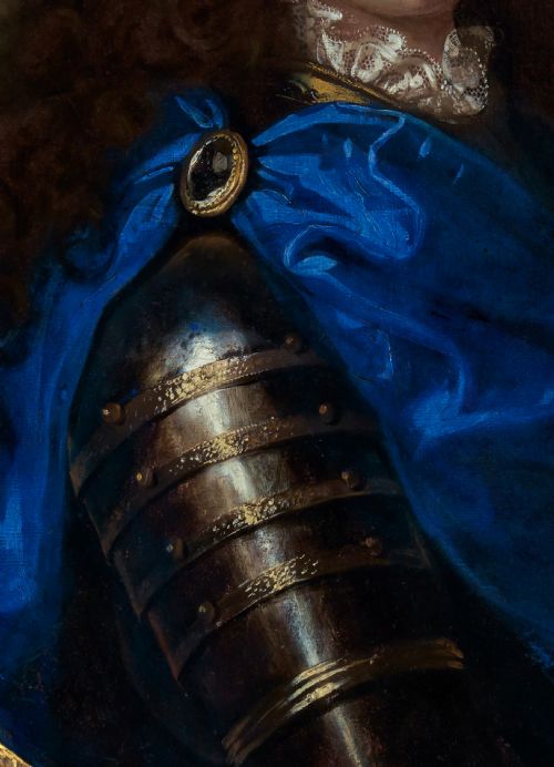 fig 5. An oval Baroque oil painting depicting a long-haired gentleman in plate armour with a bright blue cloak, presented within an ornate carved giltwood frame.