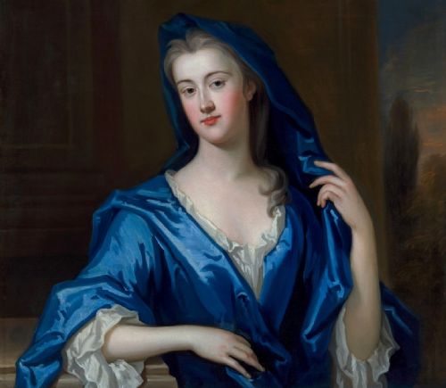 fig 3. An eighteenth-century oil portrait of a lady draped in a blue mantle, set within an intricate carved giltwood frame.
