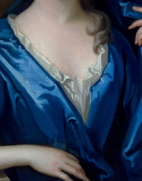 fig 4. An eighteenth-century oil portrait of a lady draped in a blue mantle, set within an intricate carved giltwood frame.