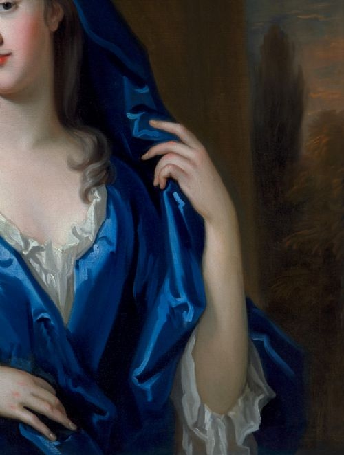 fig 7. An eighteenth-century oil portrait of a lady draped in a blue mantle, set within an intricate carved giltwood frame.