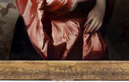 fig 4. A seventeenth-century oil portrait of a lady wearing a black dress with red satin sleeves and pearls, housed in a carved gilded frame.