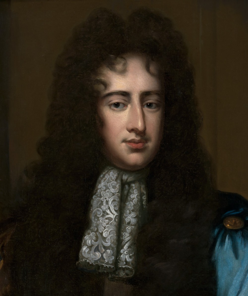 An oil portrait depicting a gentleman in a long dark wig, lace cravat, and blue cloak, presented within an ornate carved giltwood frame. View VII