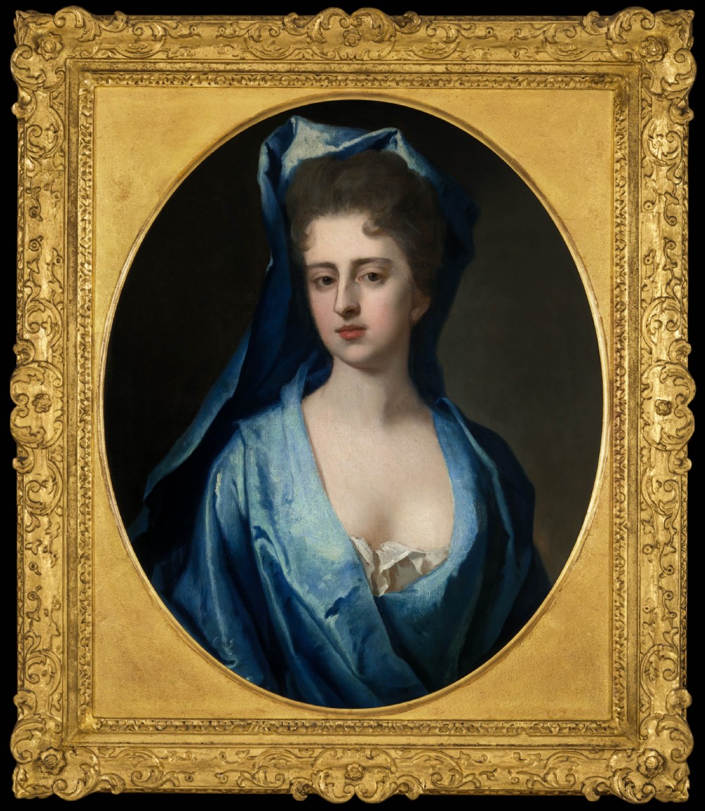 Pair of early eighteenth-century oil portraits on canvas featuring a man and a woman in blue drapery framed in elaborate carved gold giltwood frames. View II