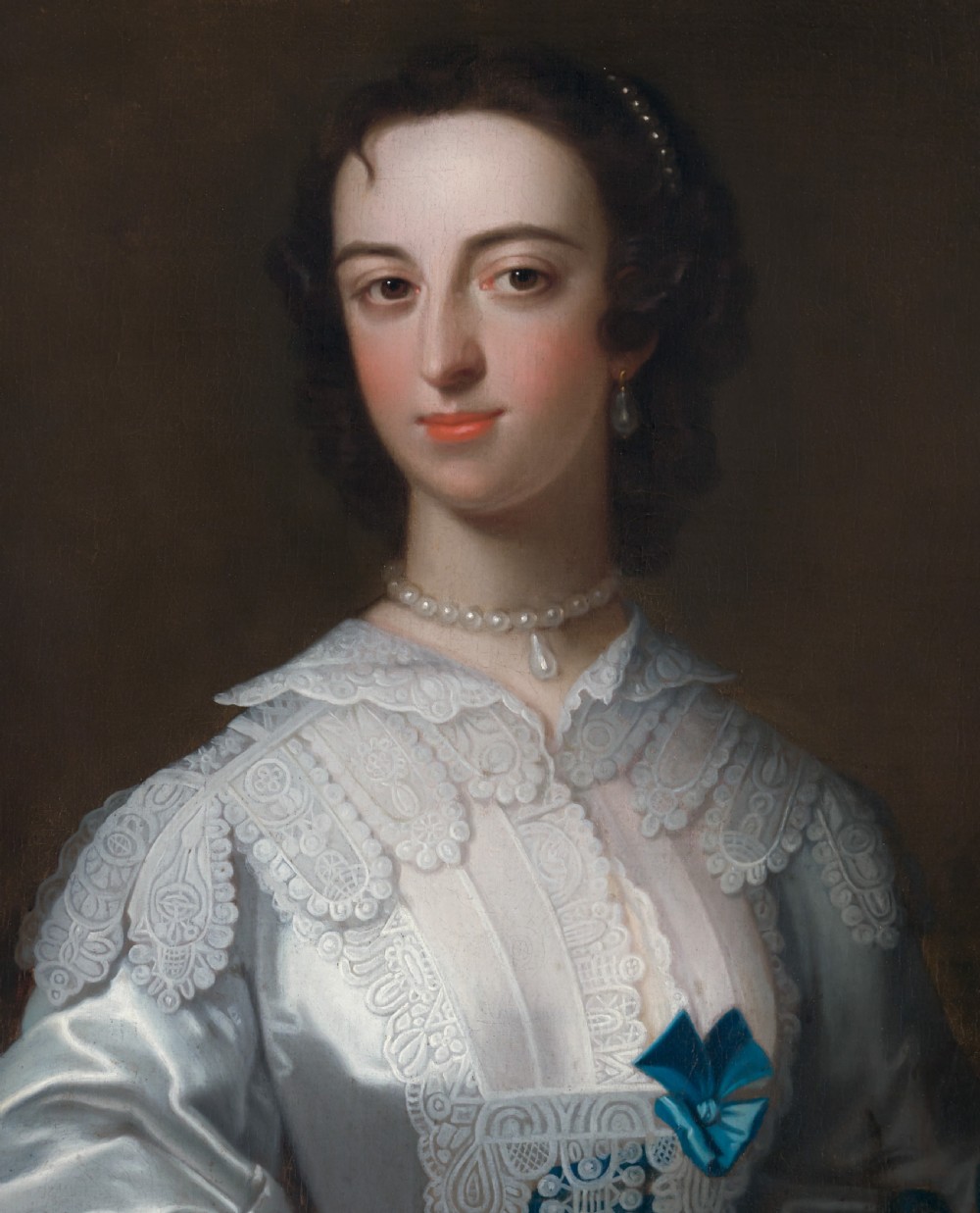 An 18th-century oil portrait depicting a lady in a white silk dress adorned with blue ribbons, housed within a ornate gilded frame. View IV