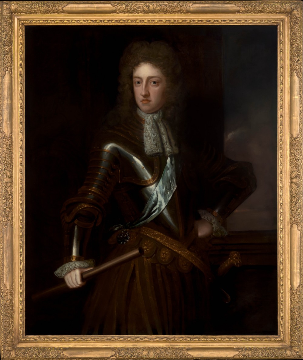 A late seventeenth-century oil portrait of a nobleman wearing full plate armour and a lace cravat, set within a carved gilded frame.