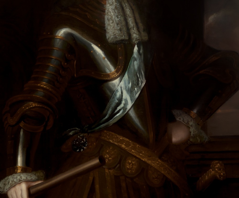 A late seventeenth-century oil portrait of a nobleman wearing full plate armour and a lace cravat, set within a carved gilded frame. View VII