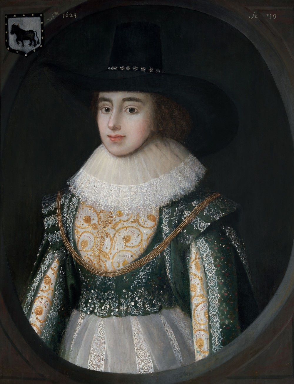 A seventeenth-century oil painting on panel featuring a woman in a wide-brimmed black hat, white lace ruff collar, and green embroidered gown within a feigned oval frame. View VI