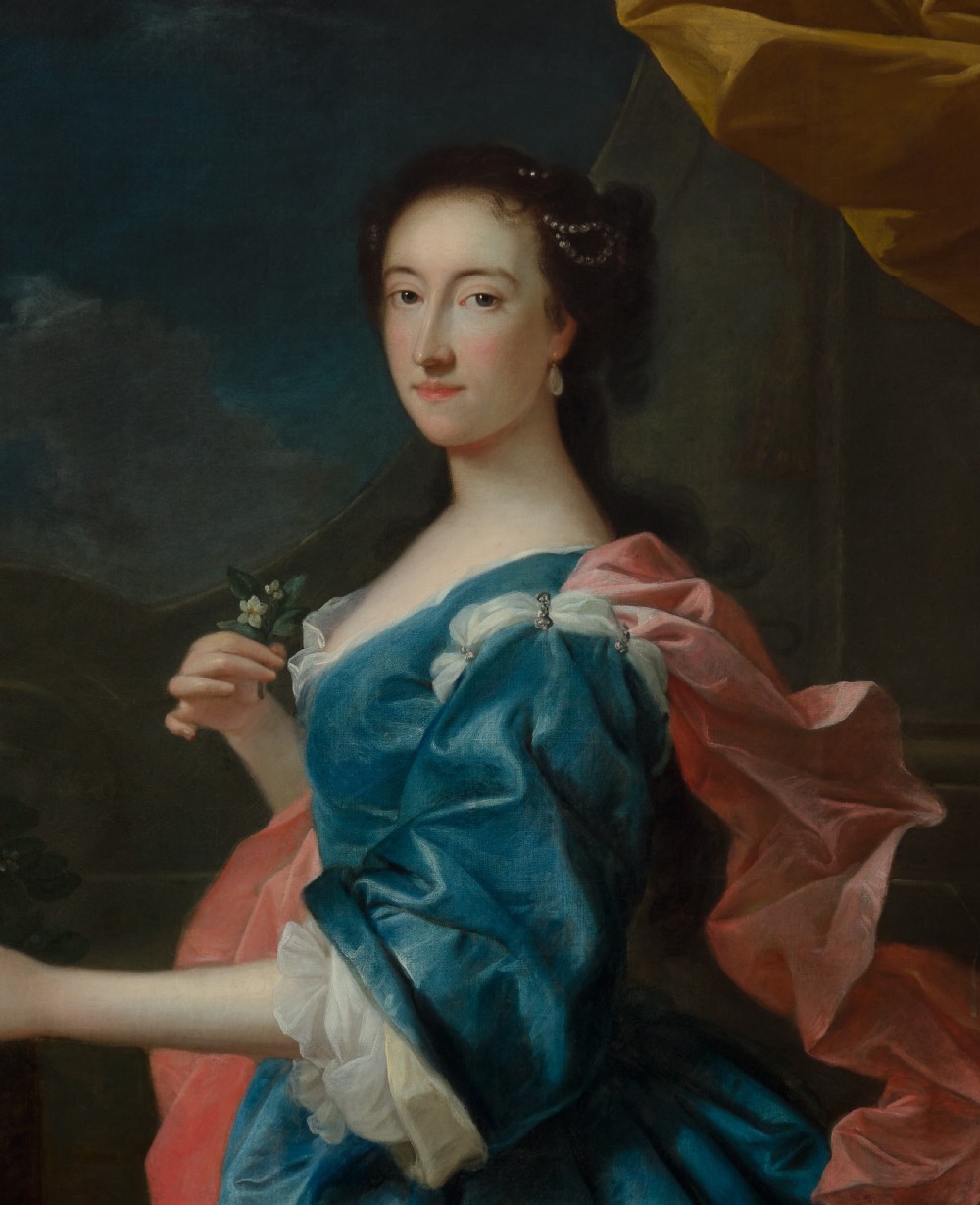 An 18th-century oil painting depicting a woman in a blue satin dress beside a potted orange tree, framed in carved giltwood. View VII