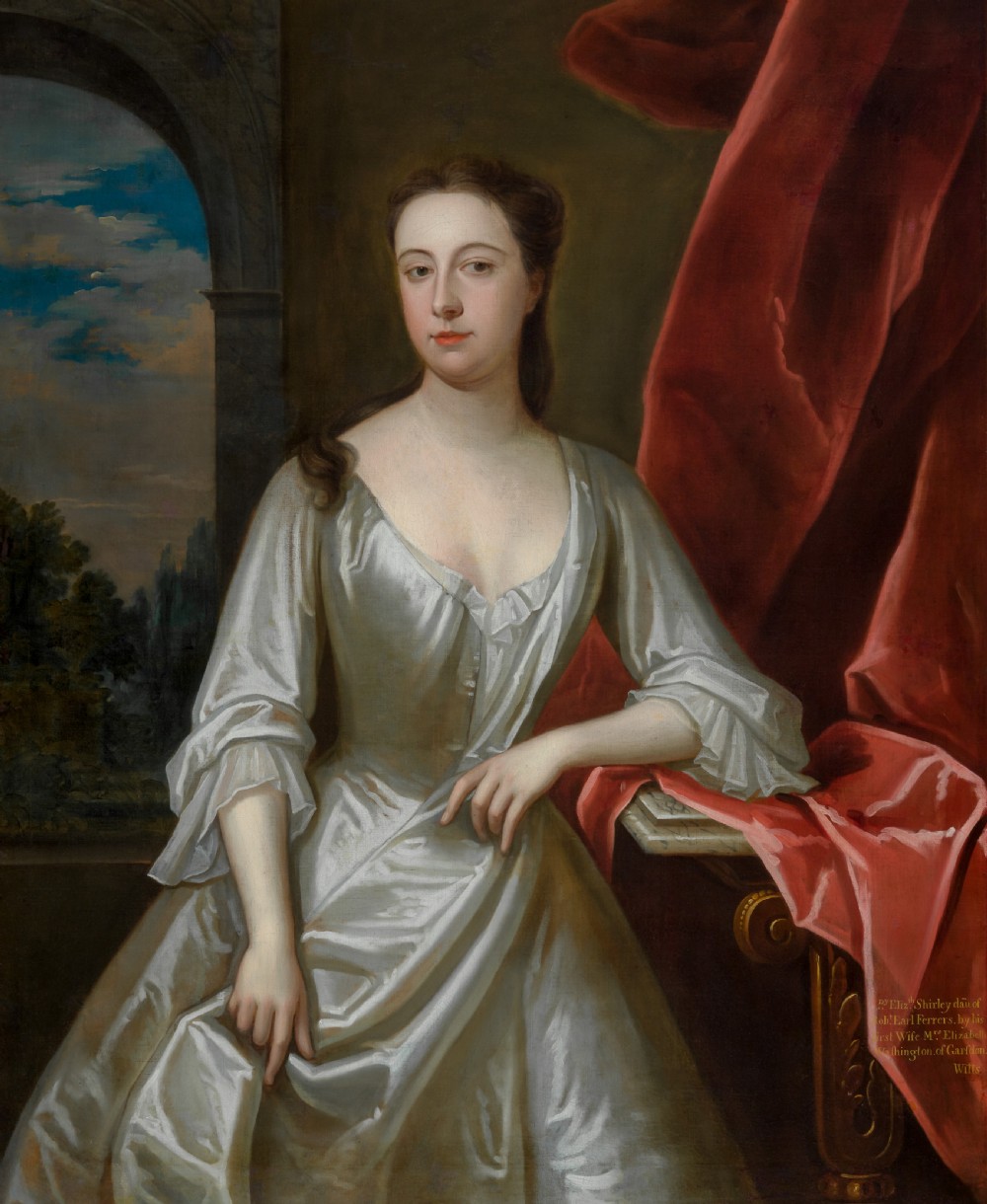 A portrait depicting a woman in a silver satin dress seated next to draped red fabric, enclosed within an ornate carved gold frame. View V