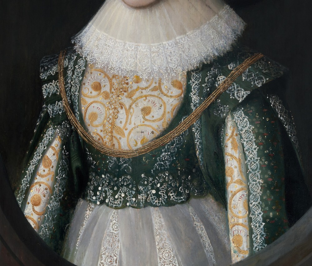 A seventeenth-century Jacobean oil portrait on wood panel depicting a woman in a wide-brimmed hat, lace ruff, and embroidered green bodice within a dark frame. View VI