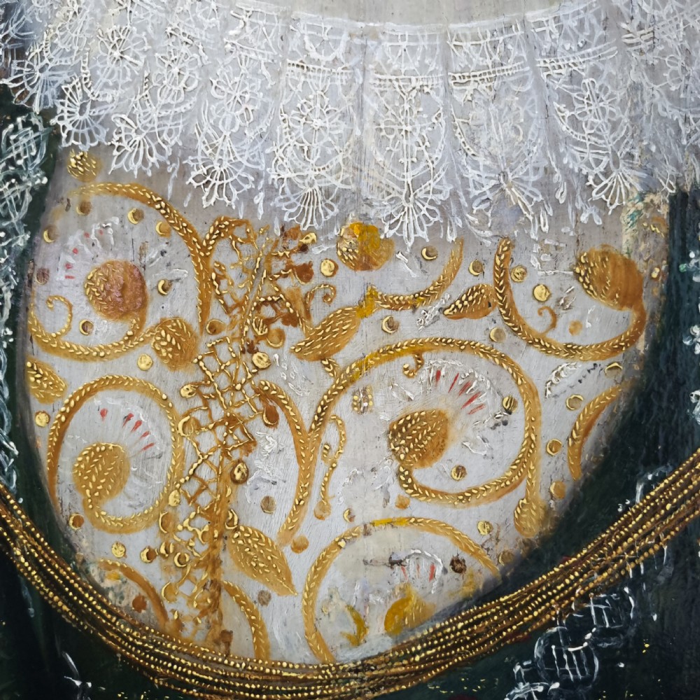 A seventeenth-century Jacobean oil portrait on wood panel depicting a woman in a wide-brimmed hat, lace ruff, and embroidered green bodice within a dark frame. View VIII