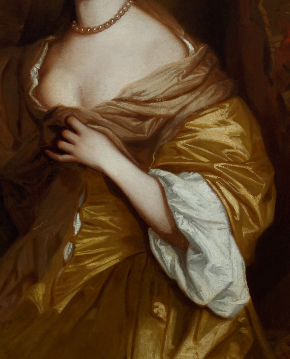 A 17th-century oil painting depicting a seated woman in a gold satin dress within a carved giltwood frame surmounted by a coronet. View X