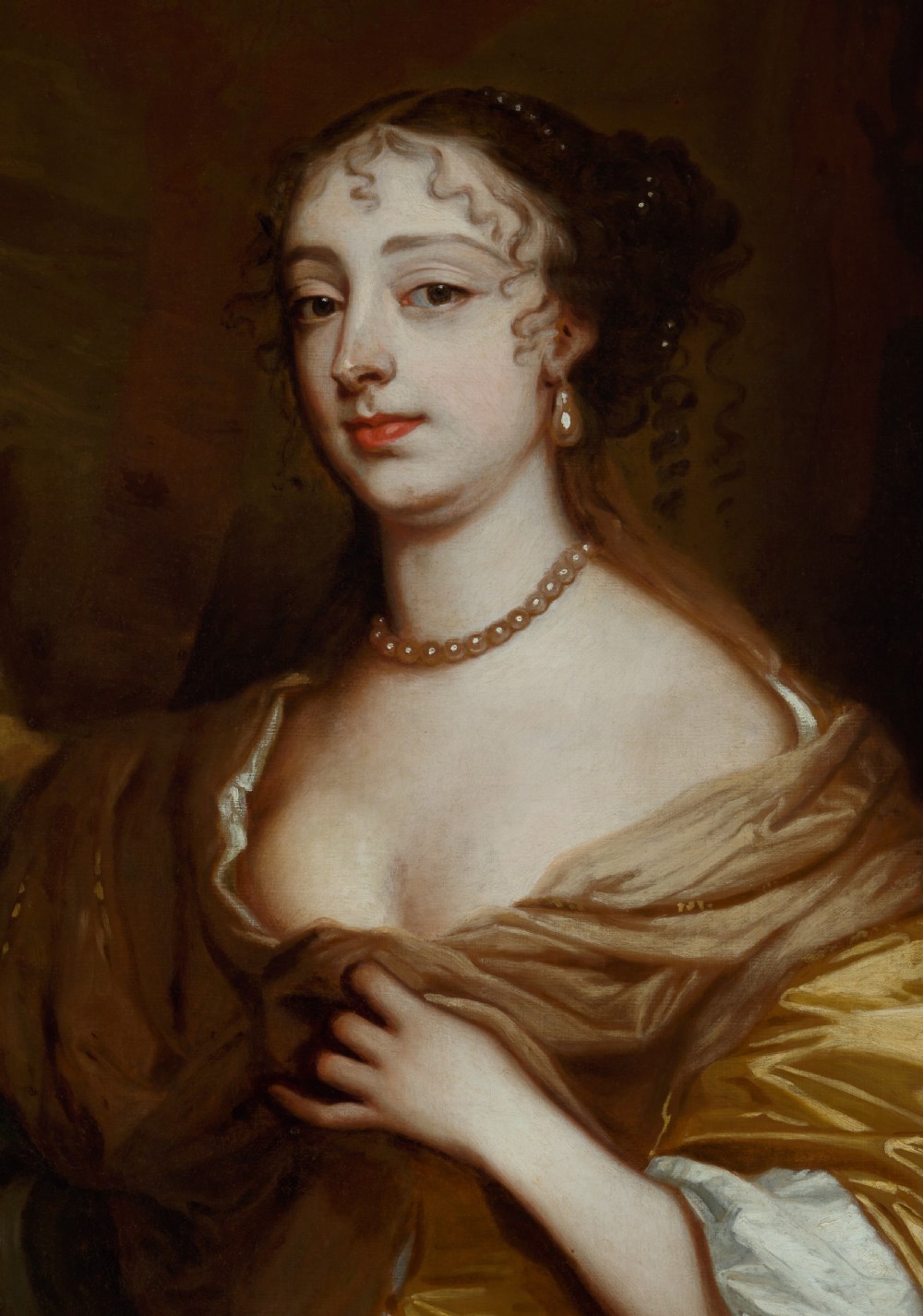 A 17th-century oil painting depicting a seated woman in a gold satin dress within a carved giltwood frame surmounted by a coronet. View XII