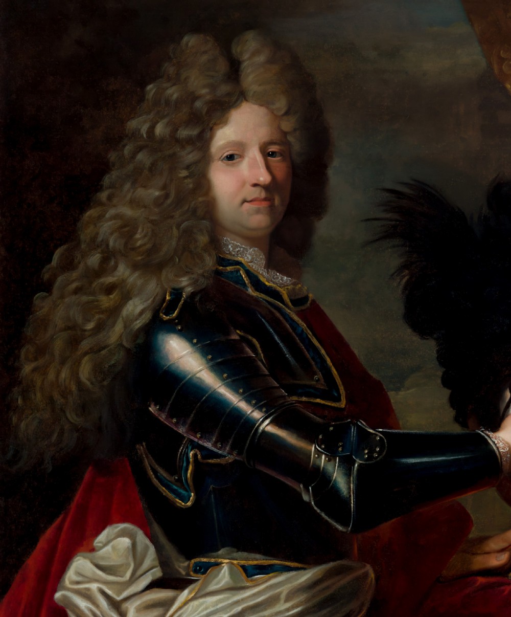 An 18th-century oil painting on canvas depicting a gentleman in plate armour and a full wig within a carved gold gilt frame. View V