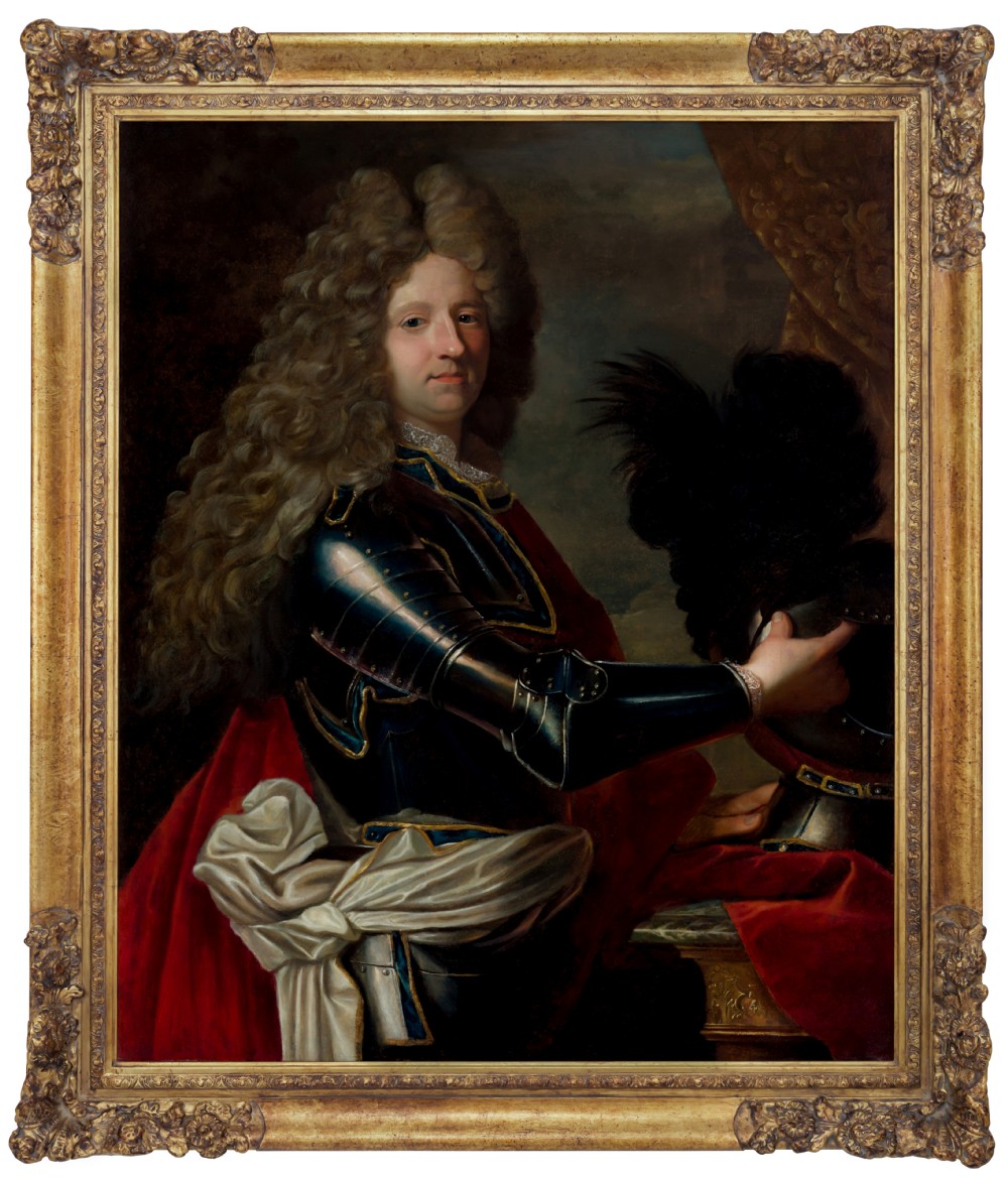 An 18th-century oil painting on canvas depicting a gentleman in plate armour and a full wig within a carved gold gilt frame.