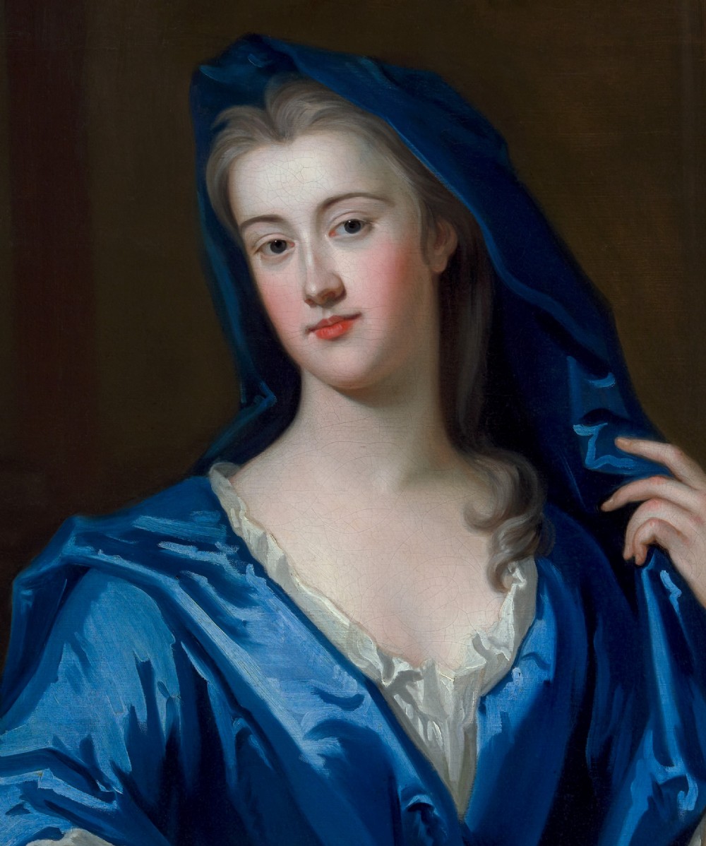 An eighteenth-century oil portrait of a lady draped in a blue mantle, set within an intricate carved giltwood frame. View VI